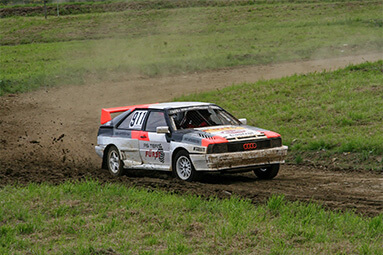 Audi rally car driving in the dirt