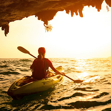 Person kayaking towards the sunset | Awards | Hippo.co.za partner