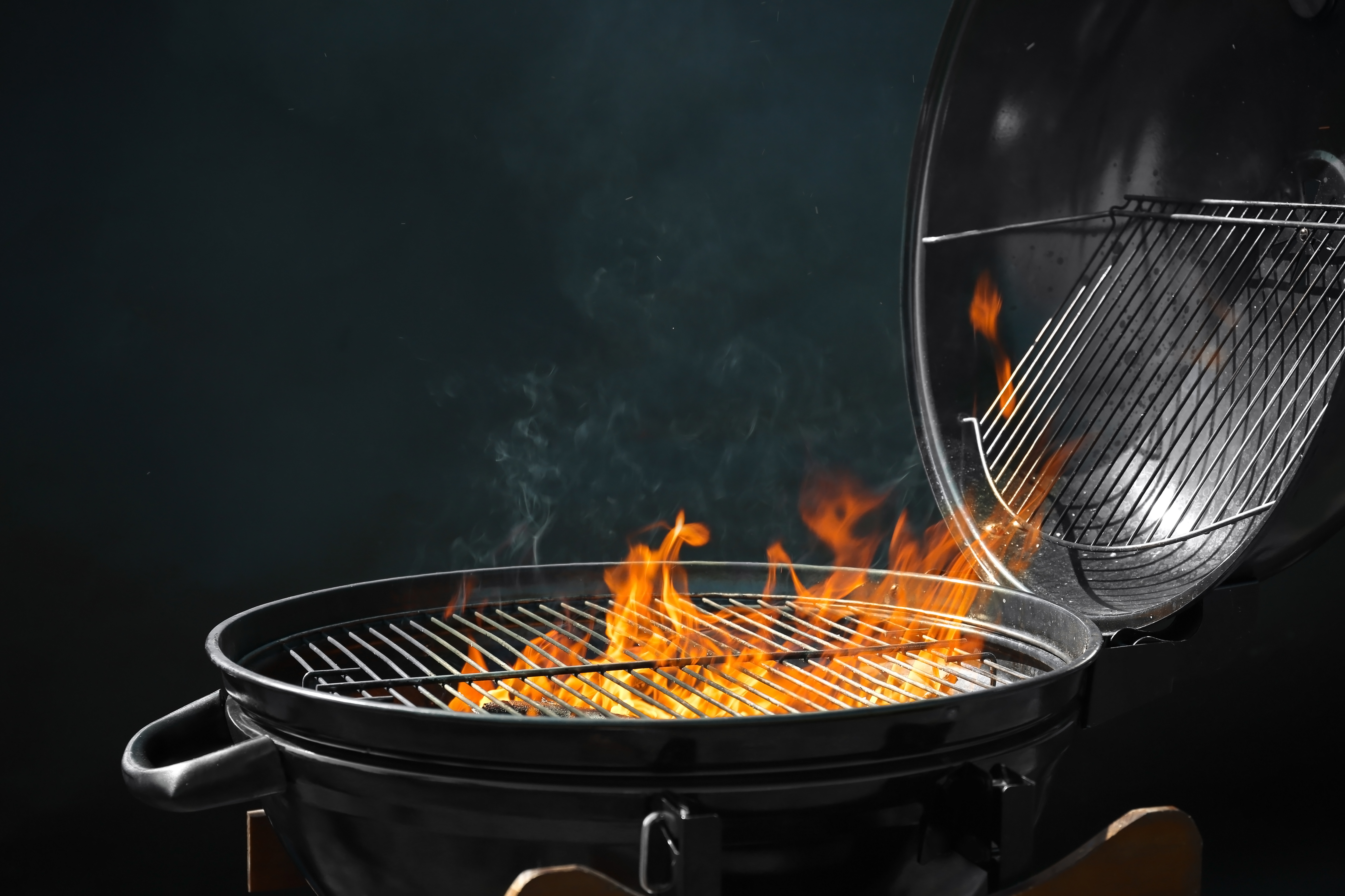 Original grill with flames, essential for outdoor Hilux-loving braai enthusiasts