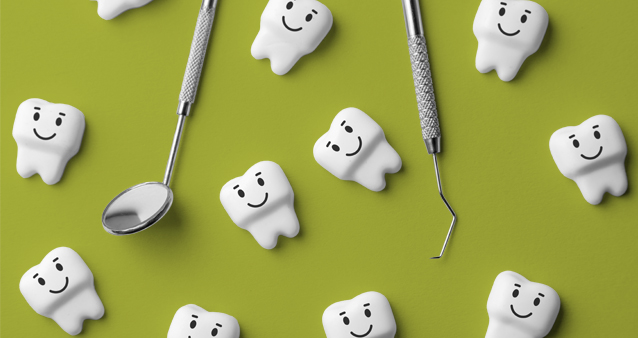 Dental tools and smiling tooth figurines on pink background, illustrating dental coverage in medical aid plans