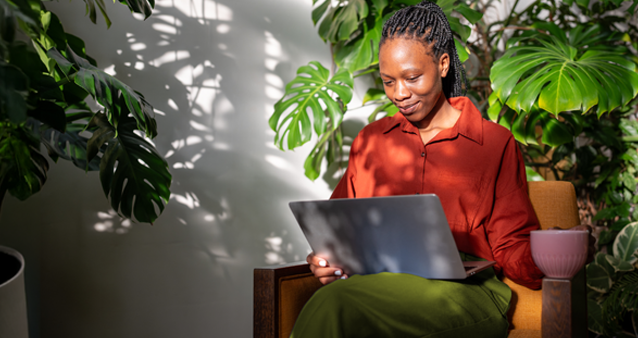 Woman comparing motor warranty plans online in peaceful setting