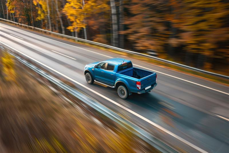 Aerial view of a Hilux Bakkie driving on an open road.