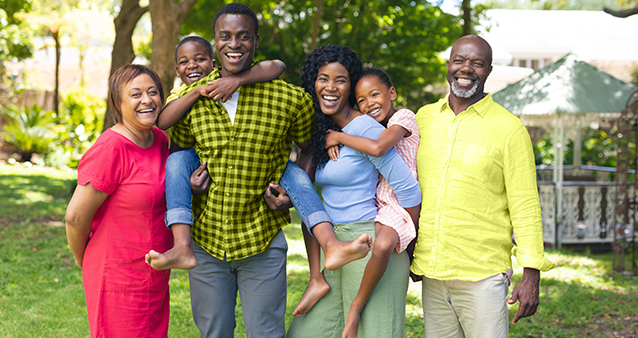 Happy, healthy family standing together