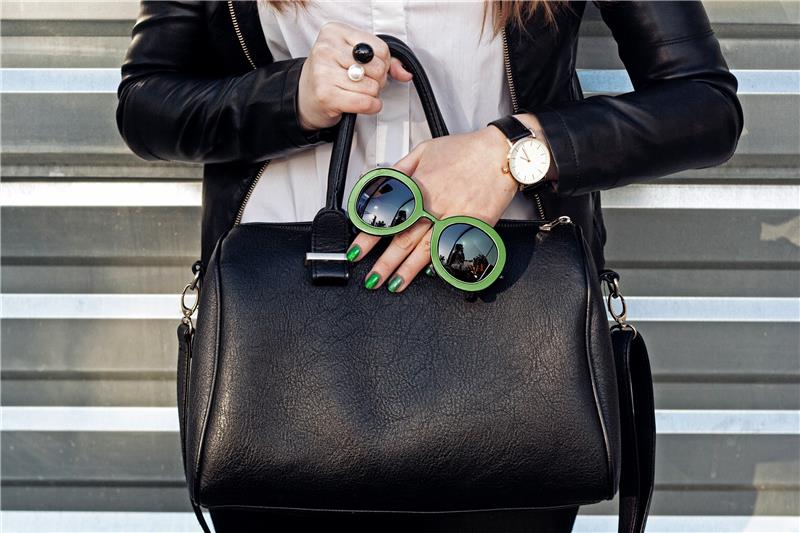 Woman with handbag in hand