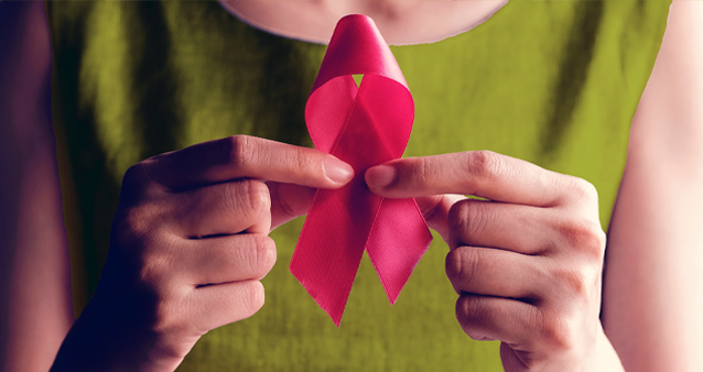 Woman holding pink breast cancer ribbon, supported by medical aids cover