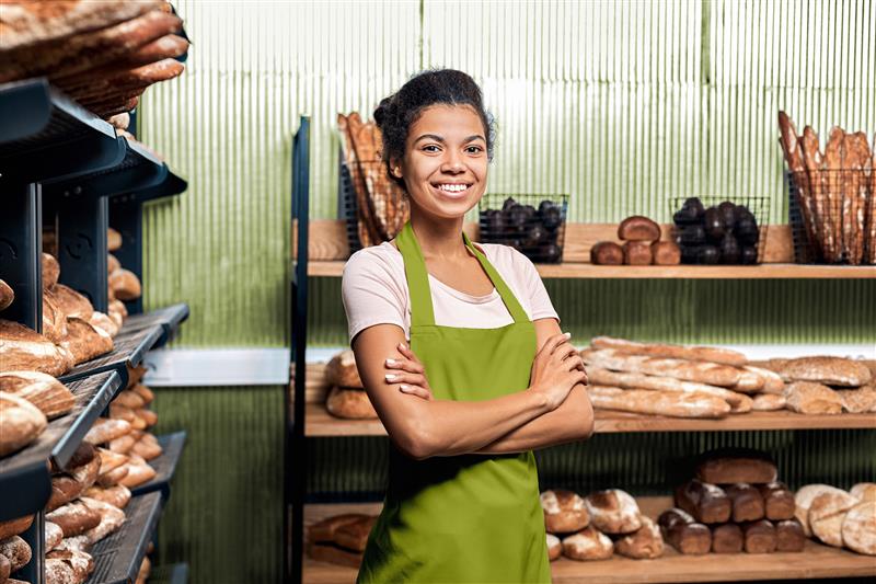 Woman standing in bakery business