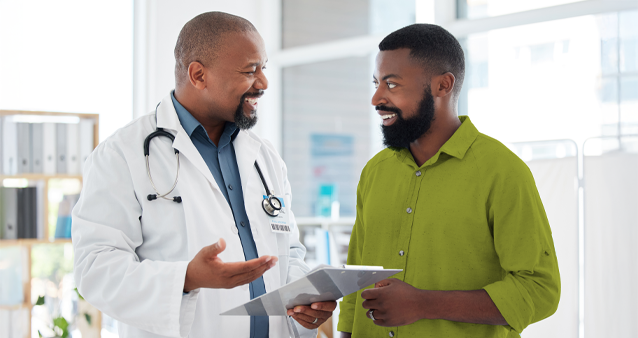 Medical scheme consultation between friendly doctor and patient in bright medical office setting