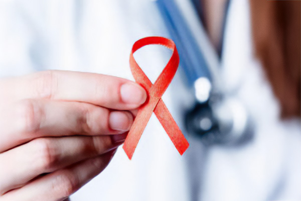 Doctor holding AIDS ribbon