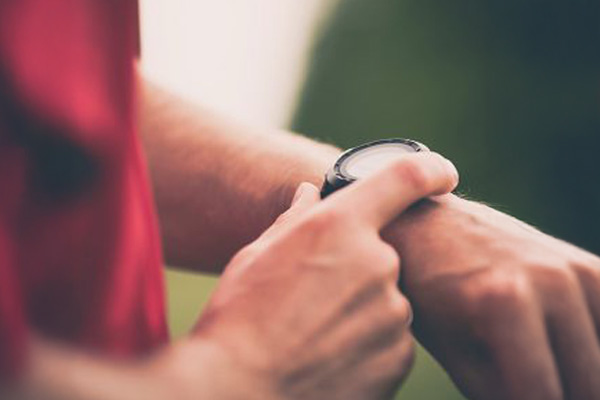 Man checking wrist watch timer 